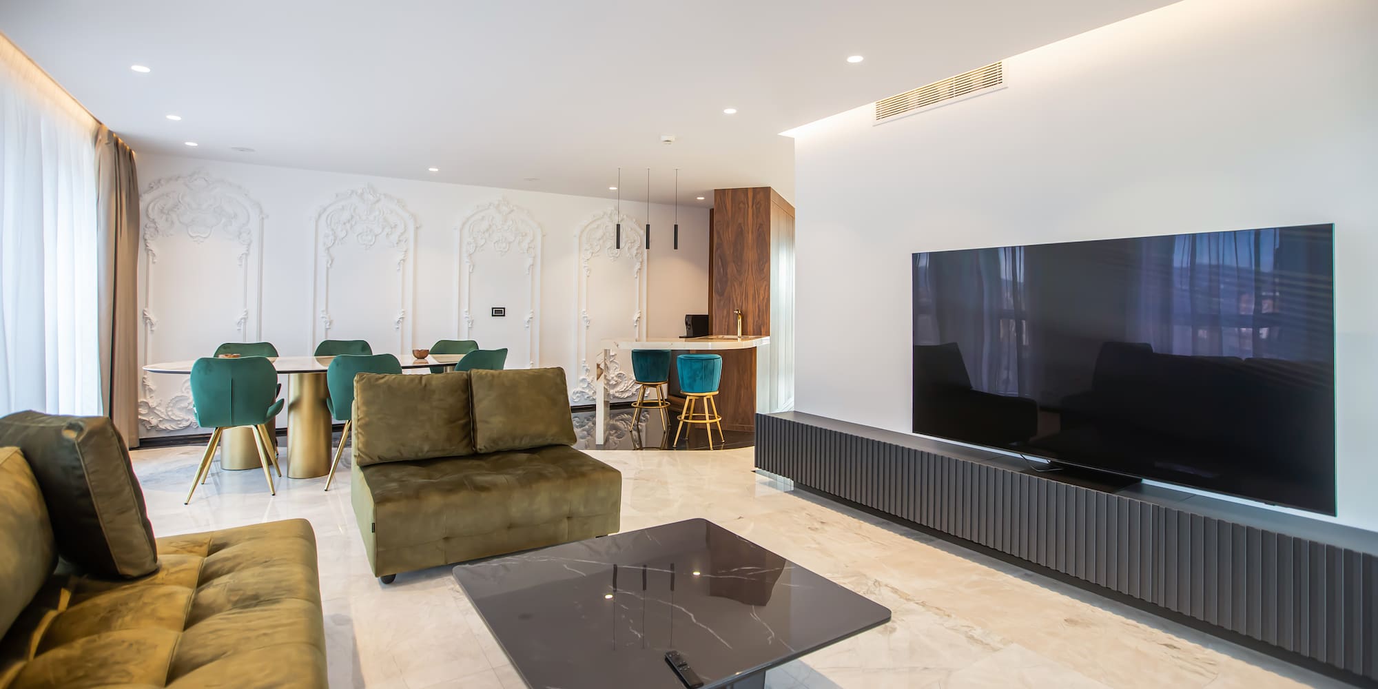 a living room with a television and a table