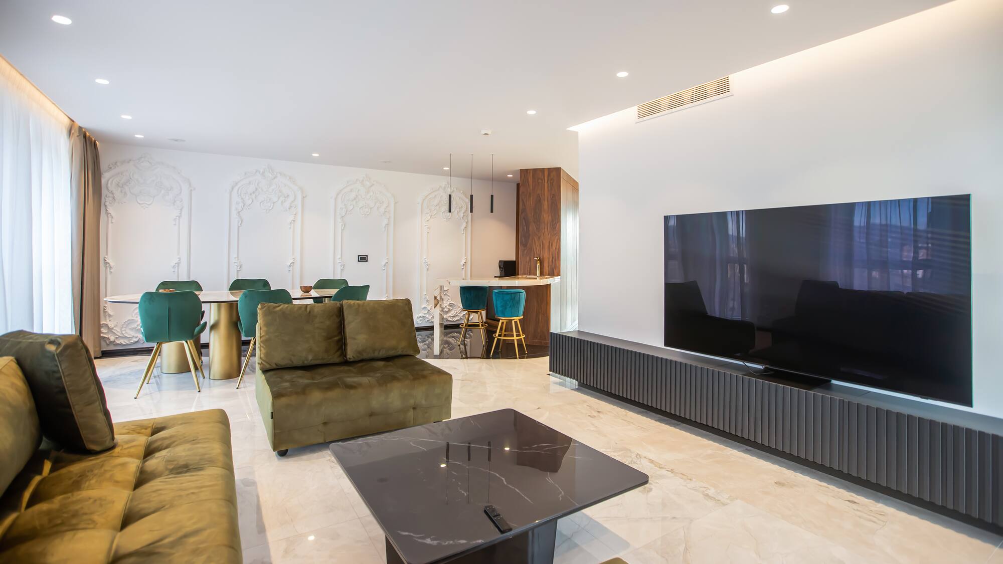 a living room with a television and a table