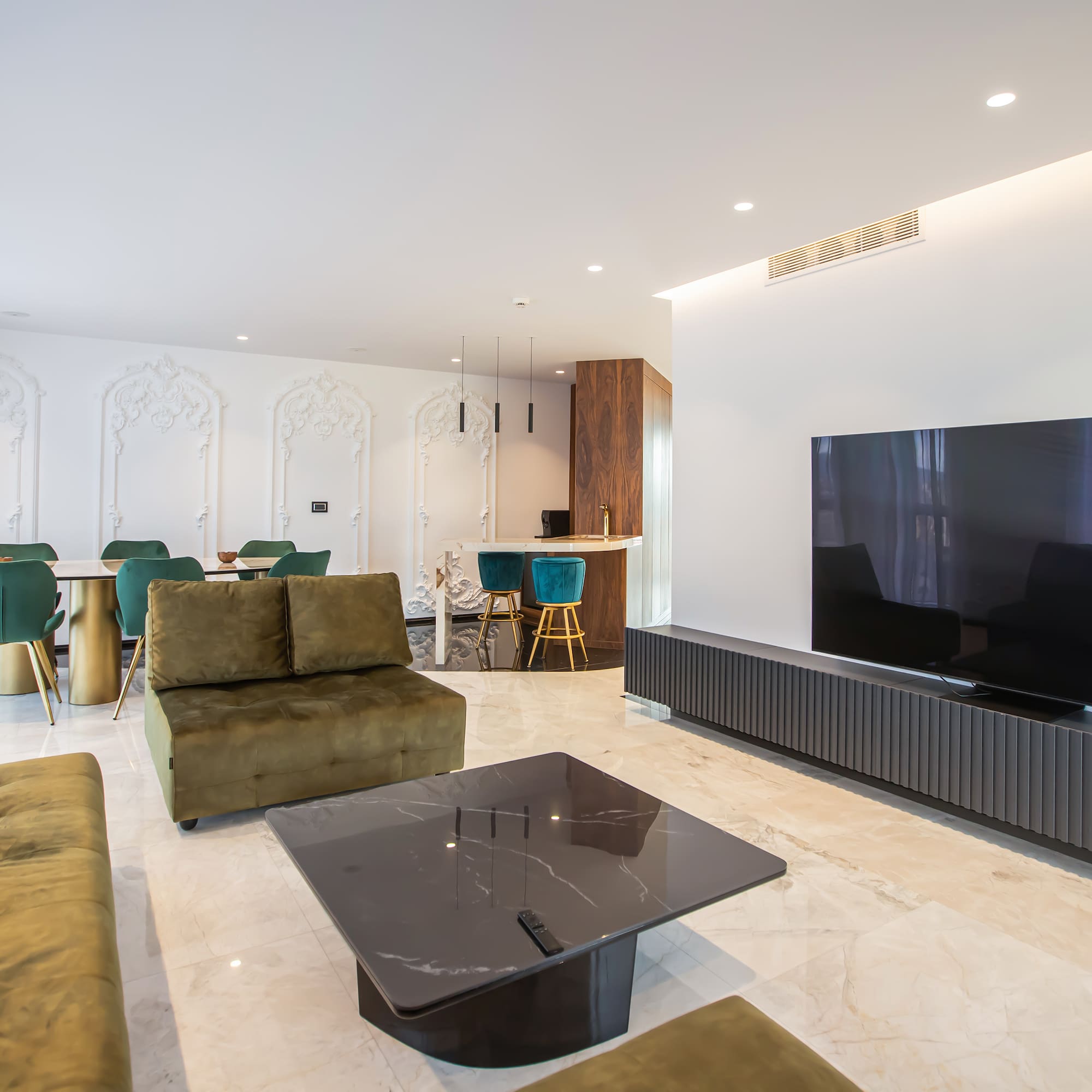 a living room with a television and a table