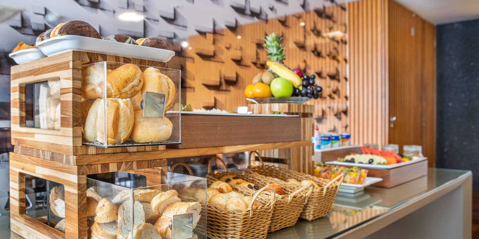 a display of bread and fruit on a counter