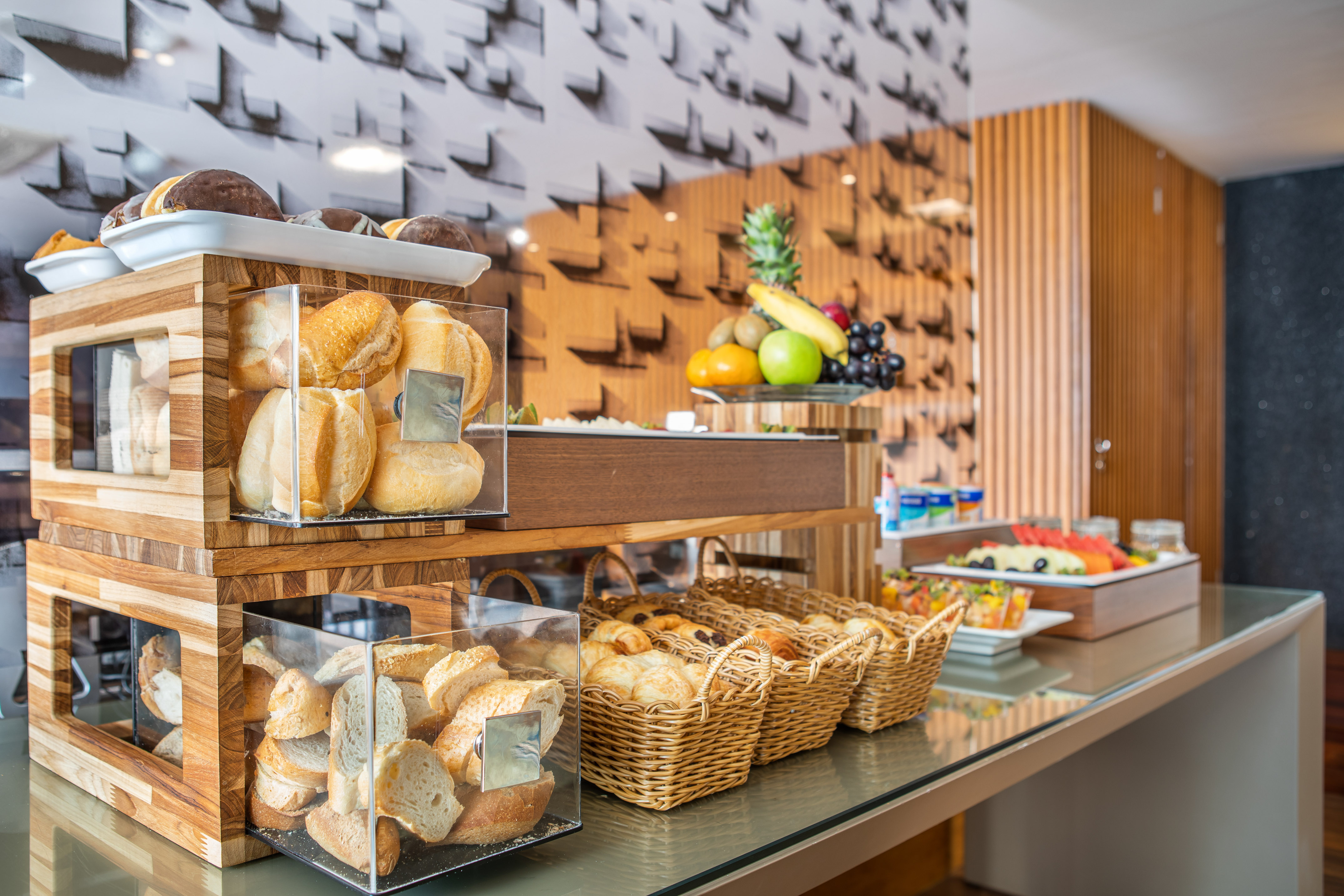 a display of bread and fruit on a counter