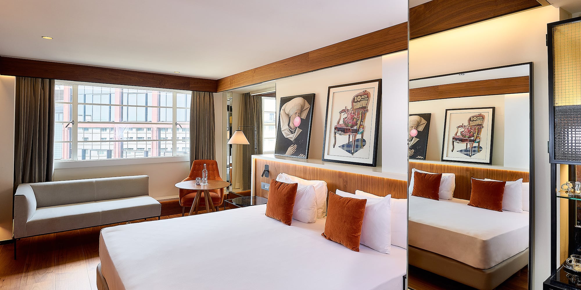 a room with a bed and a mirror