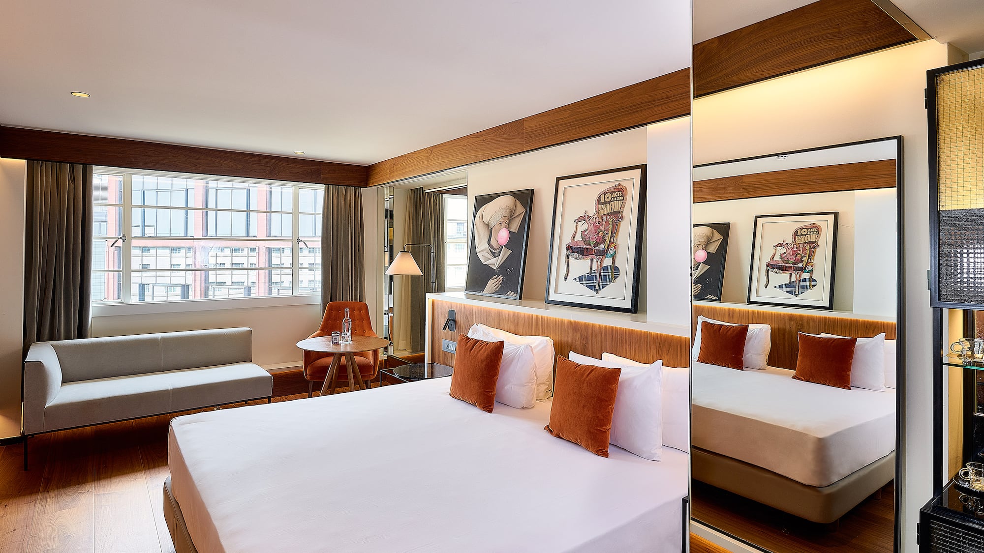 a room with a bed and a mirror