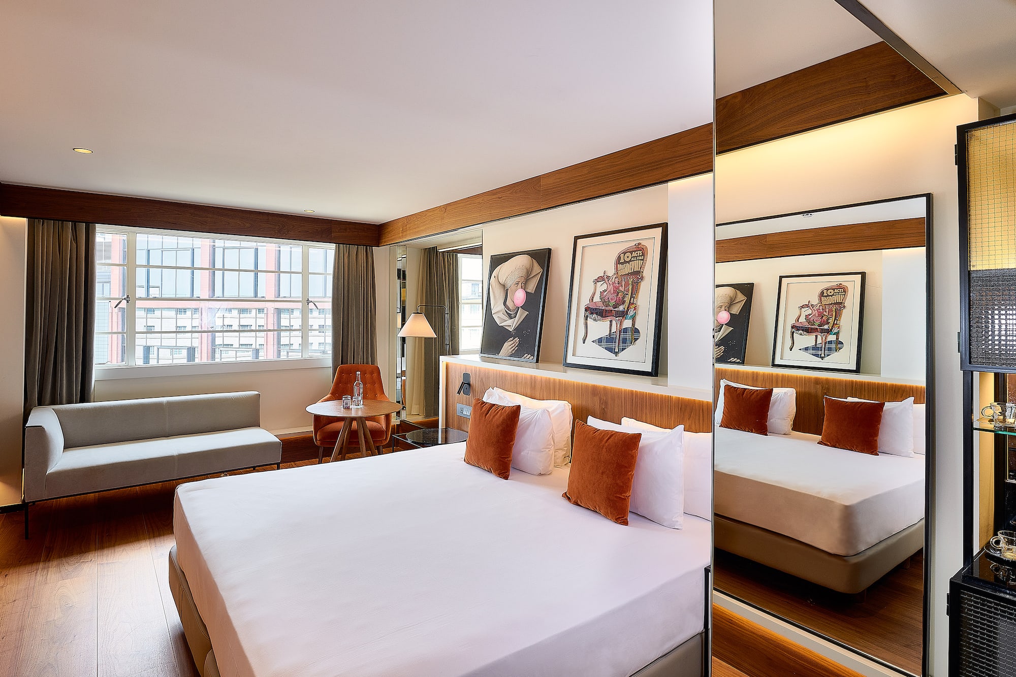 a room with a bed and a mirror