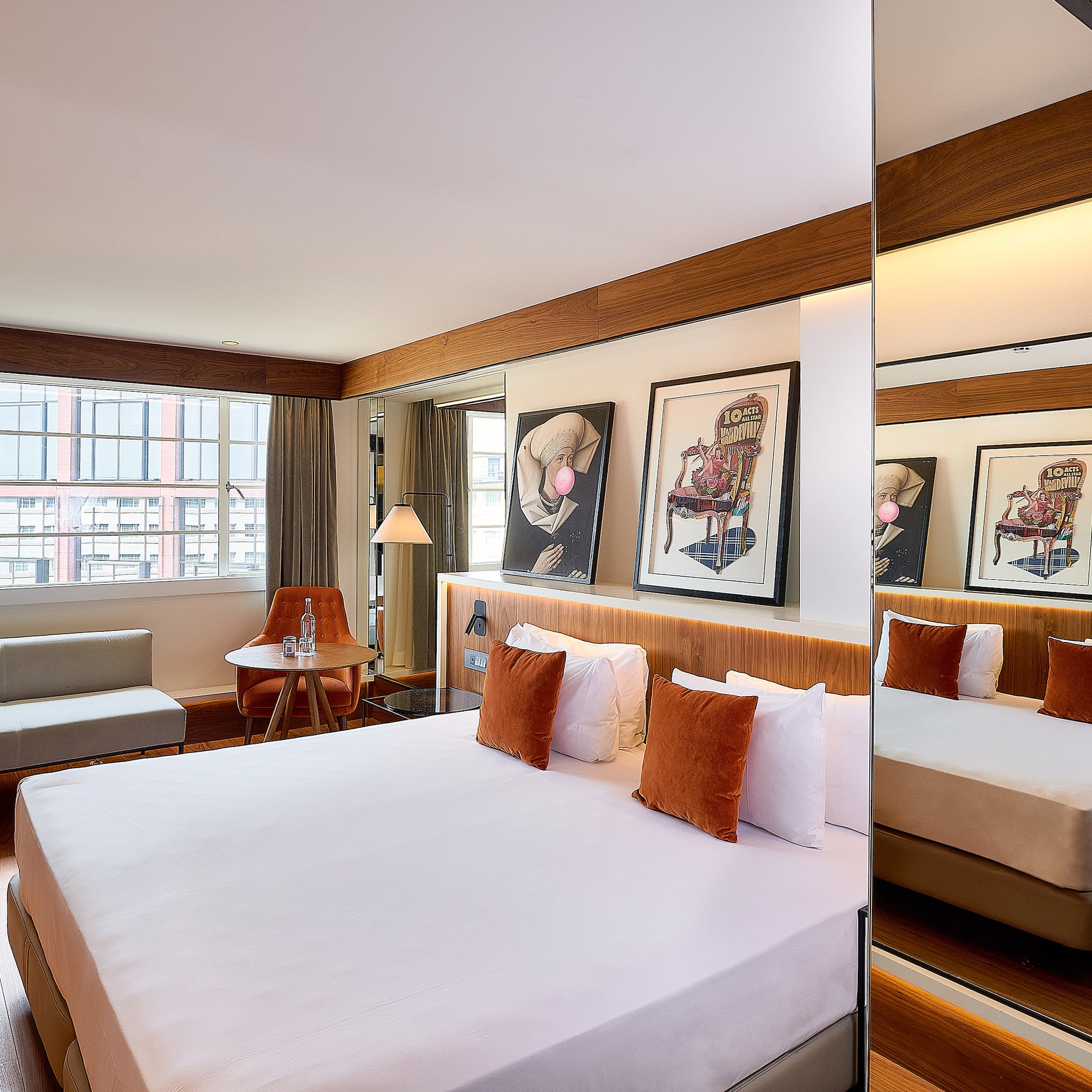 a room with a bed and a mirror