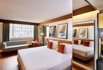 a room with a bed and a mirror