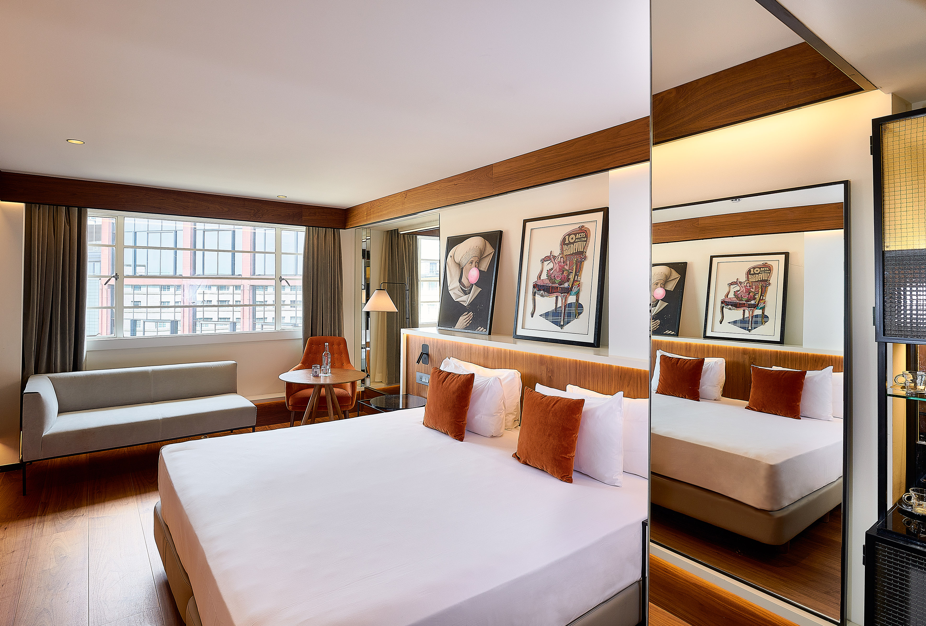 a room with a bed and a mirror