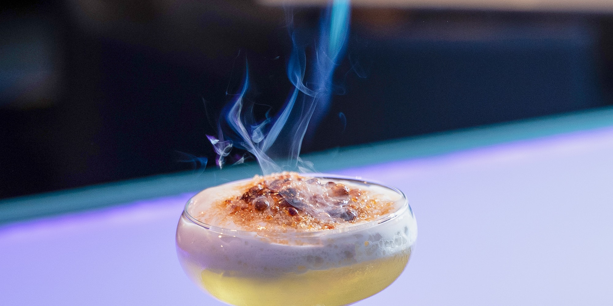 a fire coming out of a drink