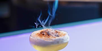 a fire coming out of a drink