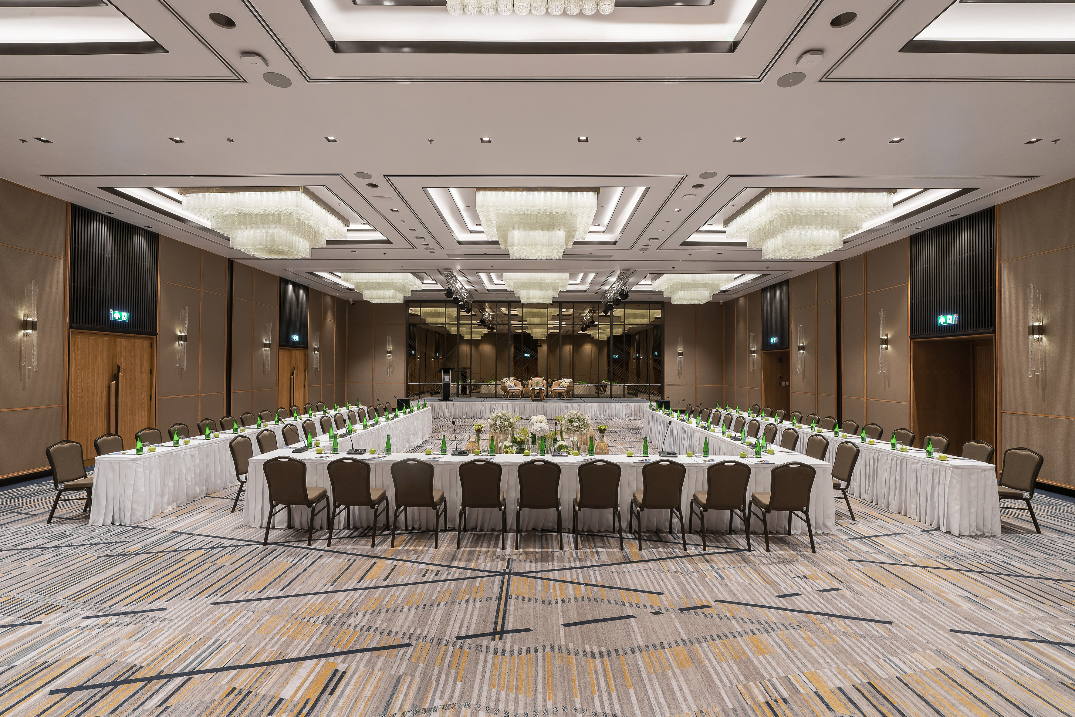 a large room with a large table set for a meeting.