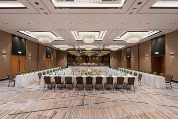 a large room with a large table set for a meeting