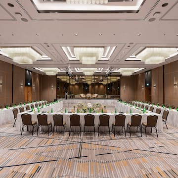 a large room with a large table set for a meeting