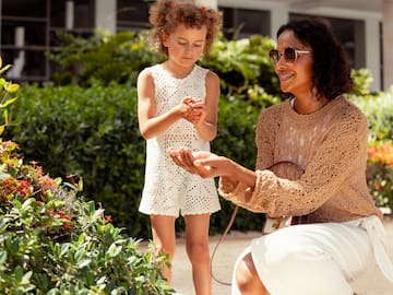 a woman and a child outside