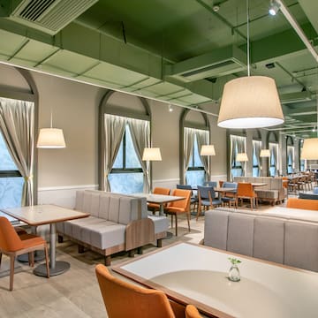 a room with tables and chairs