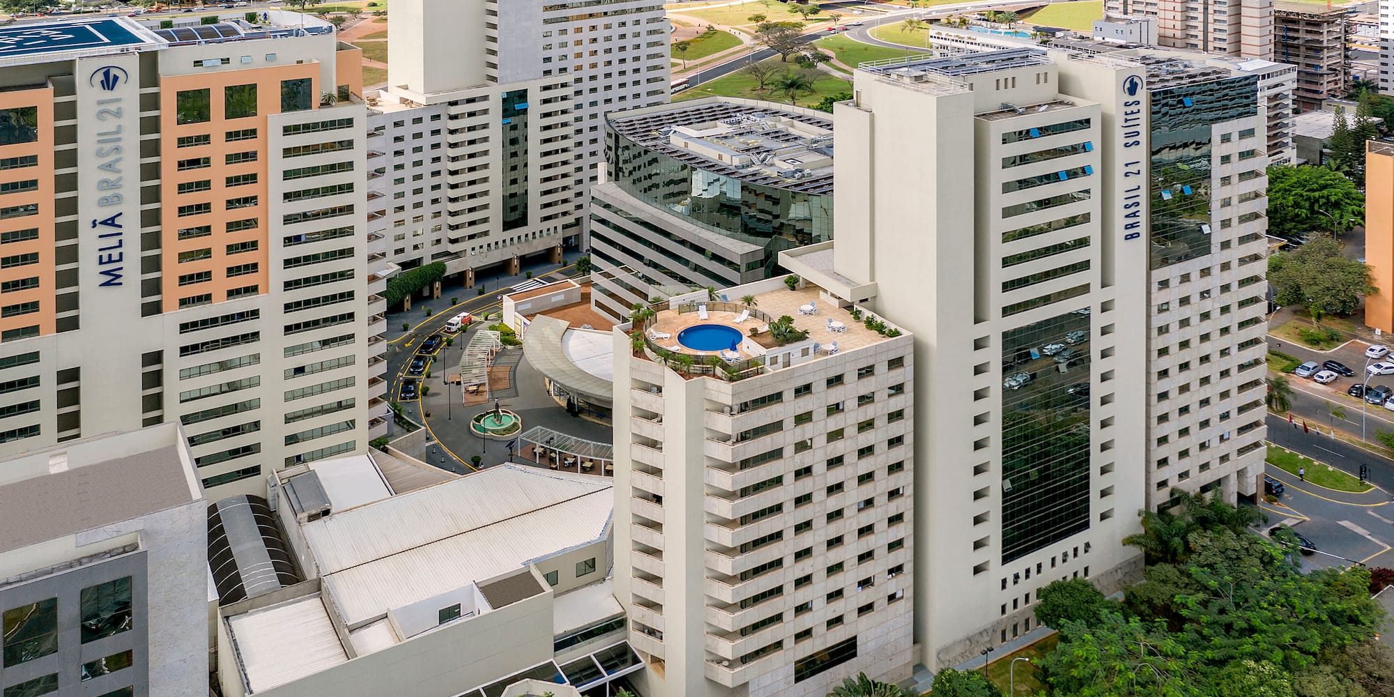 a group of buildings with a pool in the middle