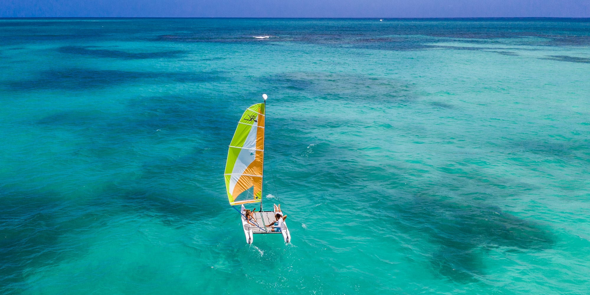 a person on a sailboat in the water