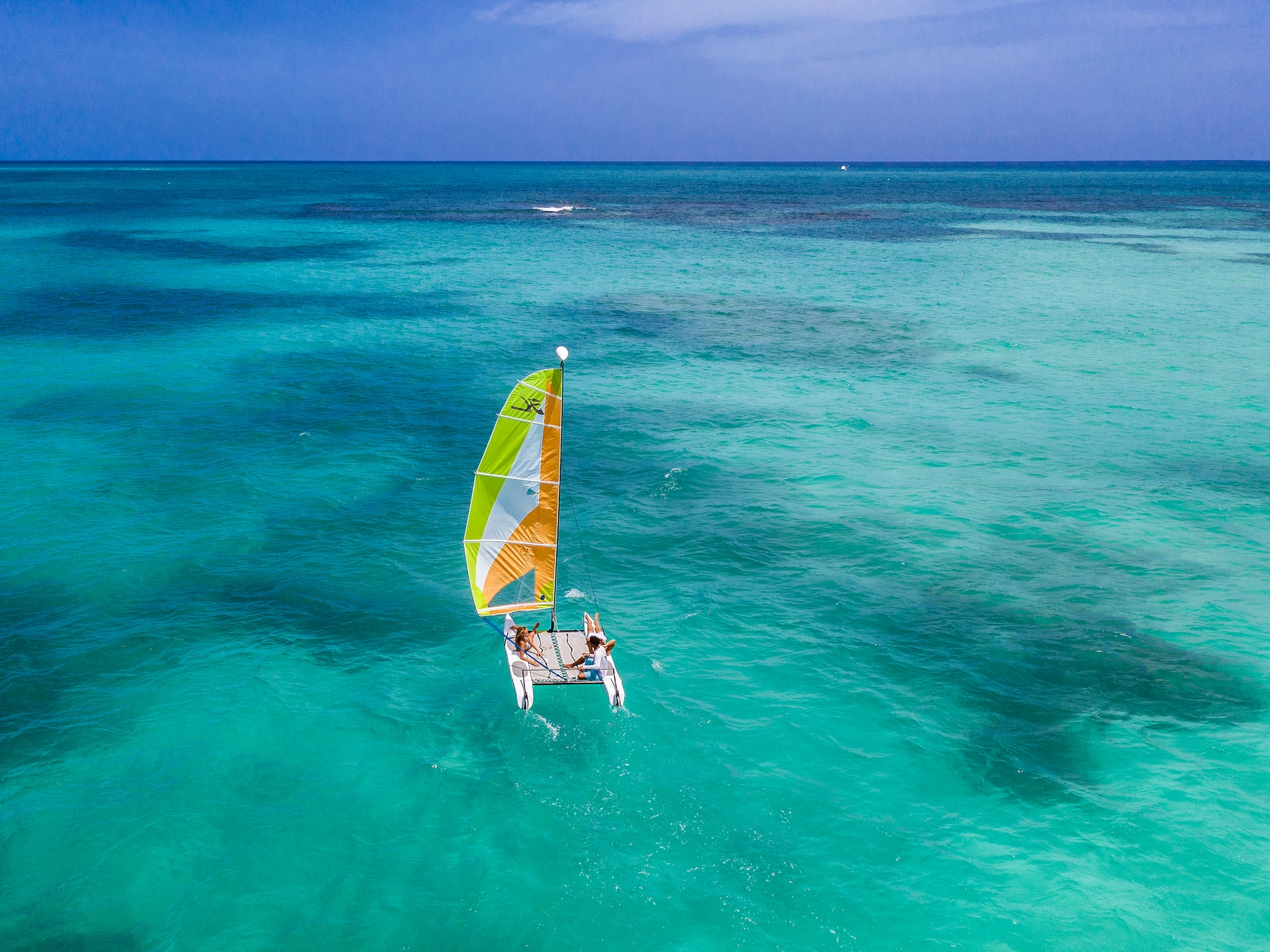 a person on a sailboat in the water