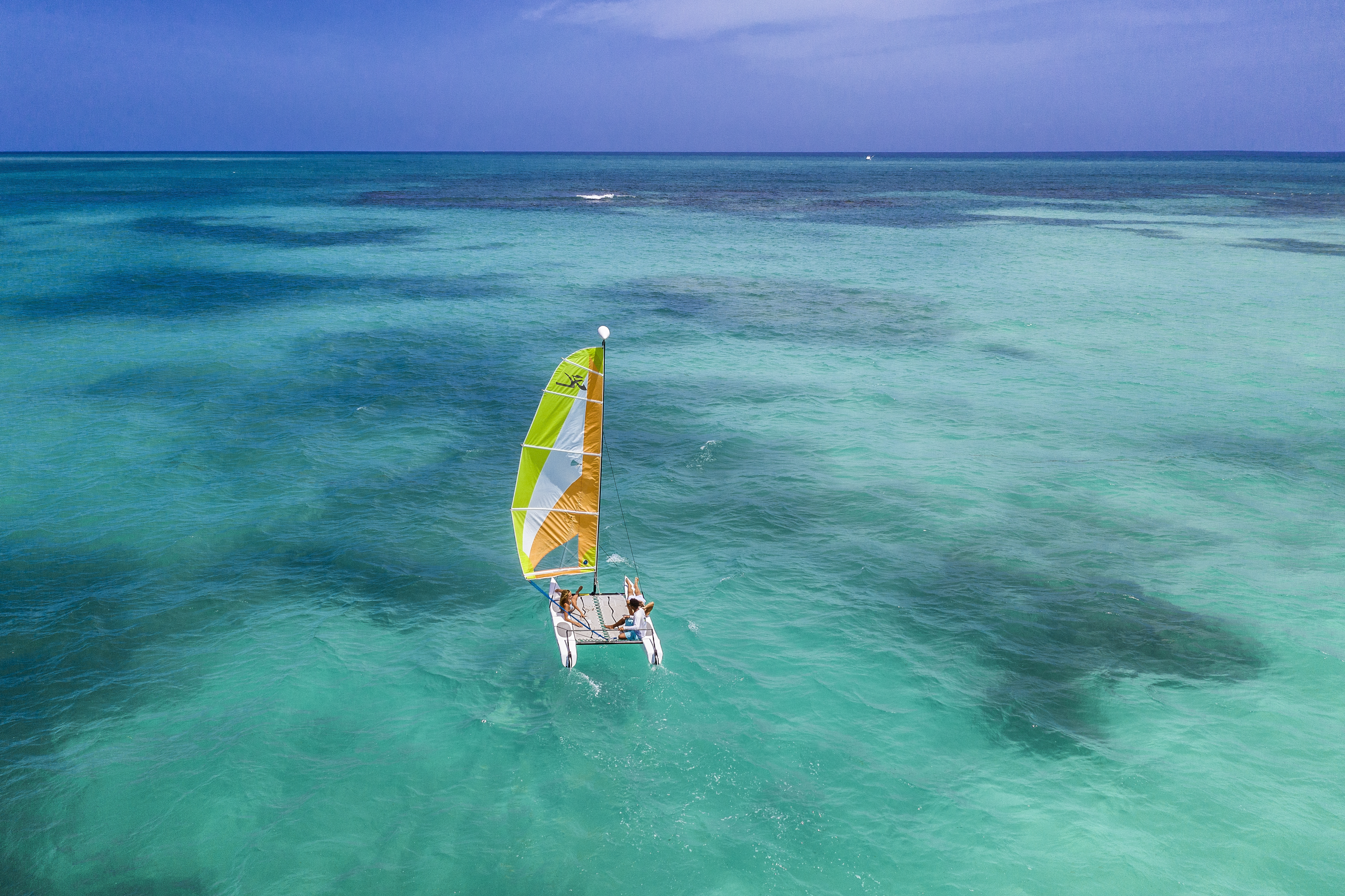 a person on a sailboat in the water