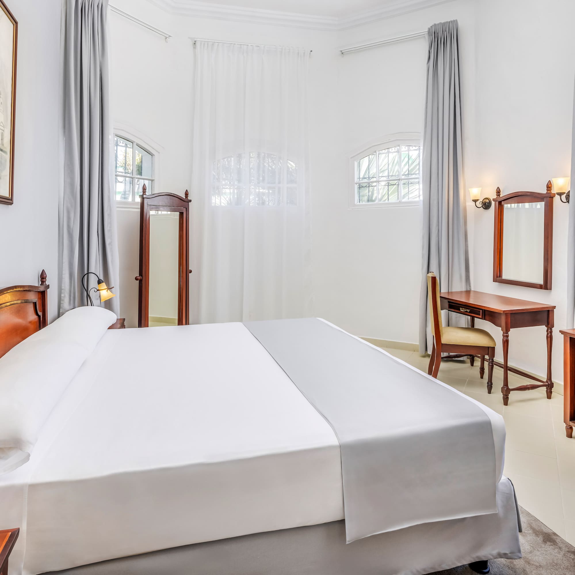 a room with a bed and a desk