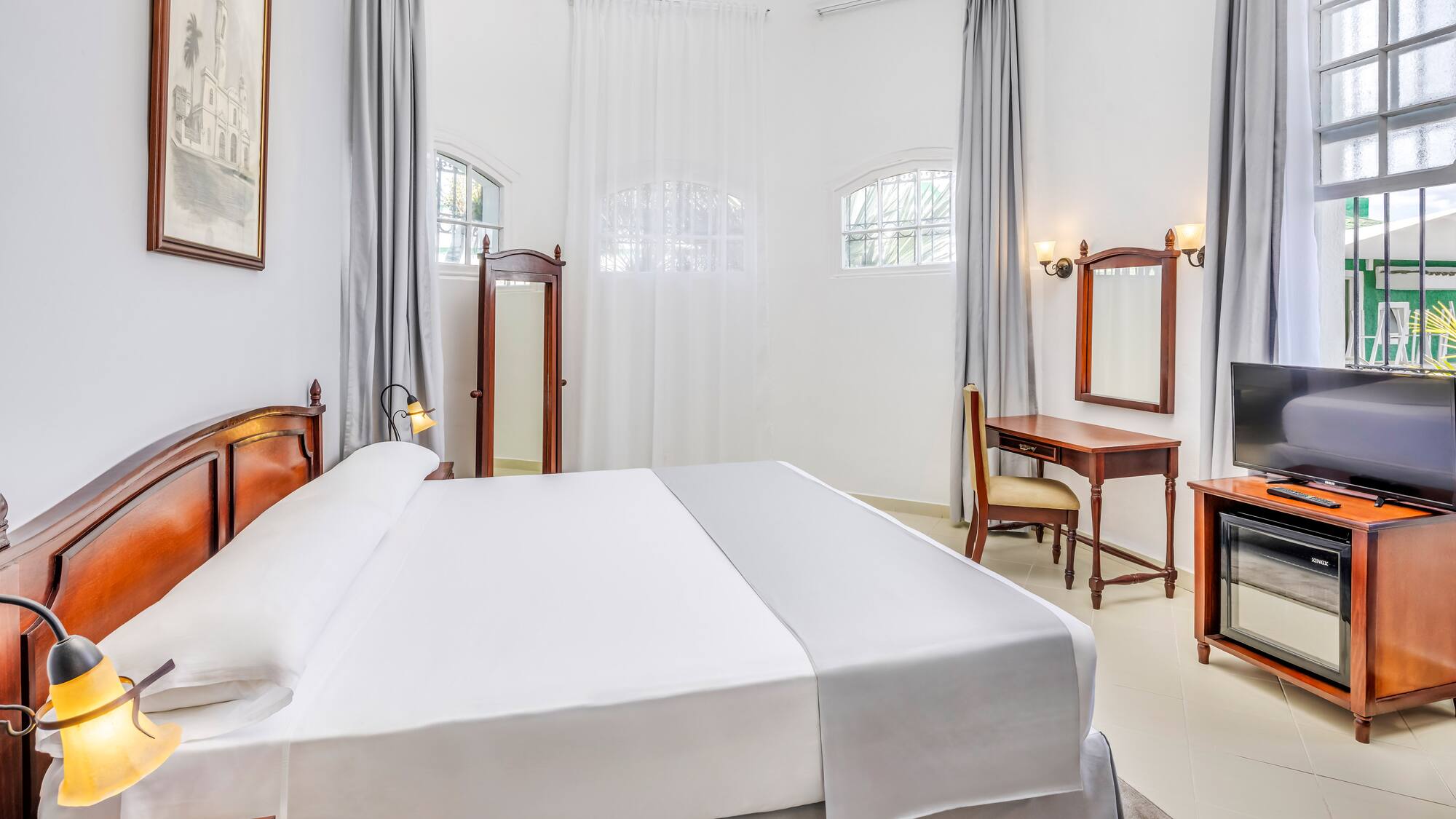 a room with a bed and a desk