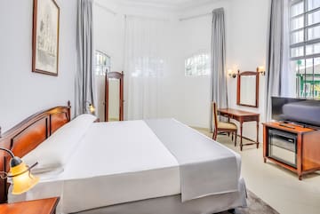 a room with a bed and a desk