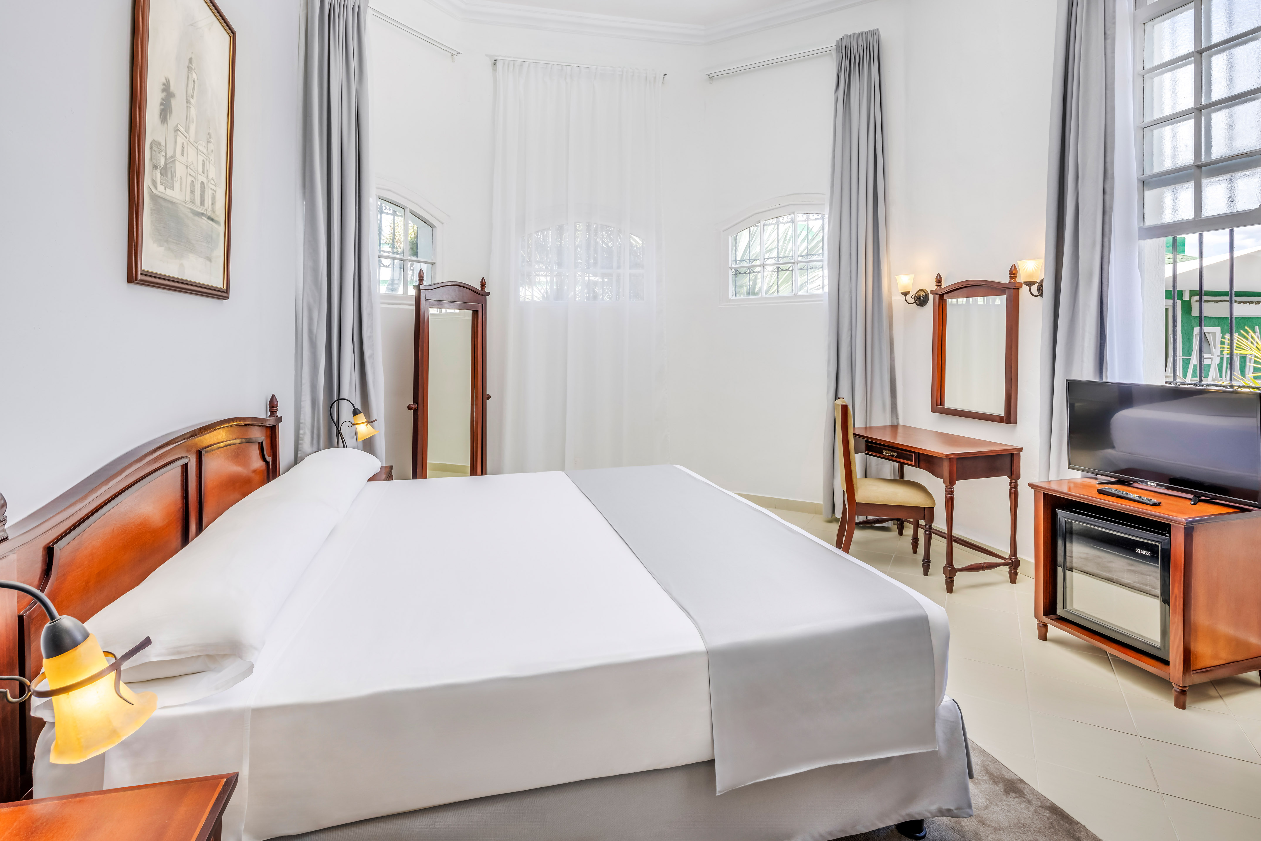 a room with a bed and a desk