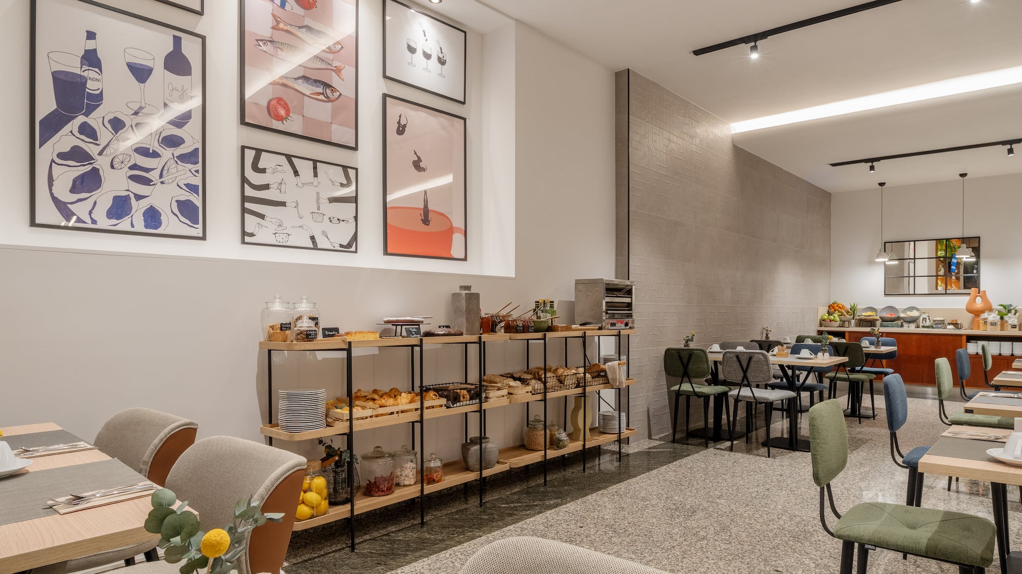 a room with a table and chairs and art on the wall