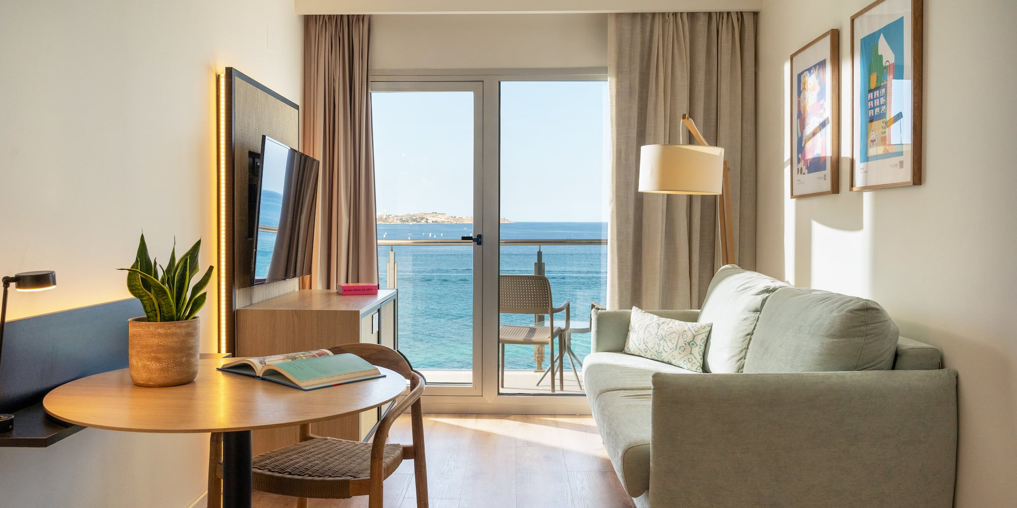 a room with a couch and a table and a television