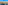 Aerial city view: residential buildings, streets, distant skyline, bright blue sky.