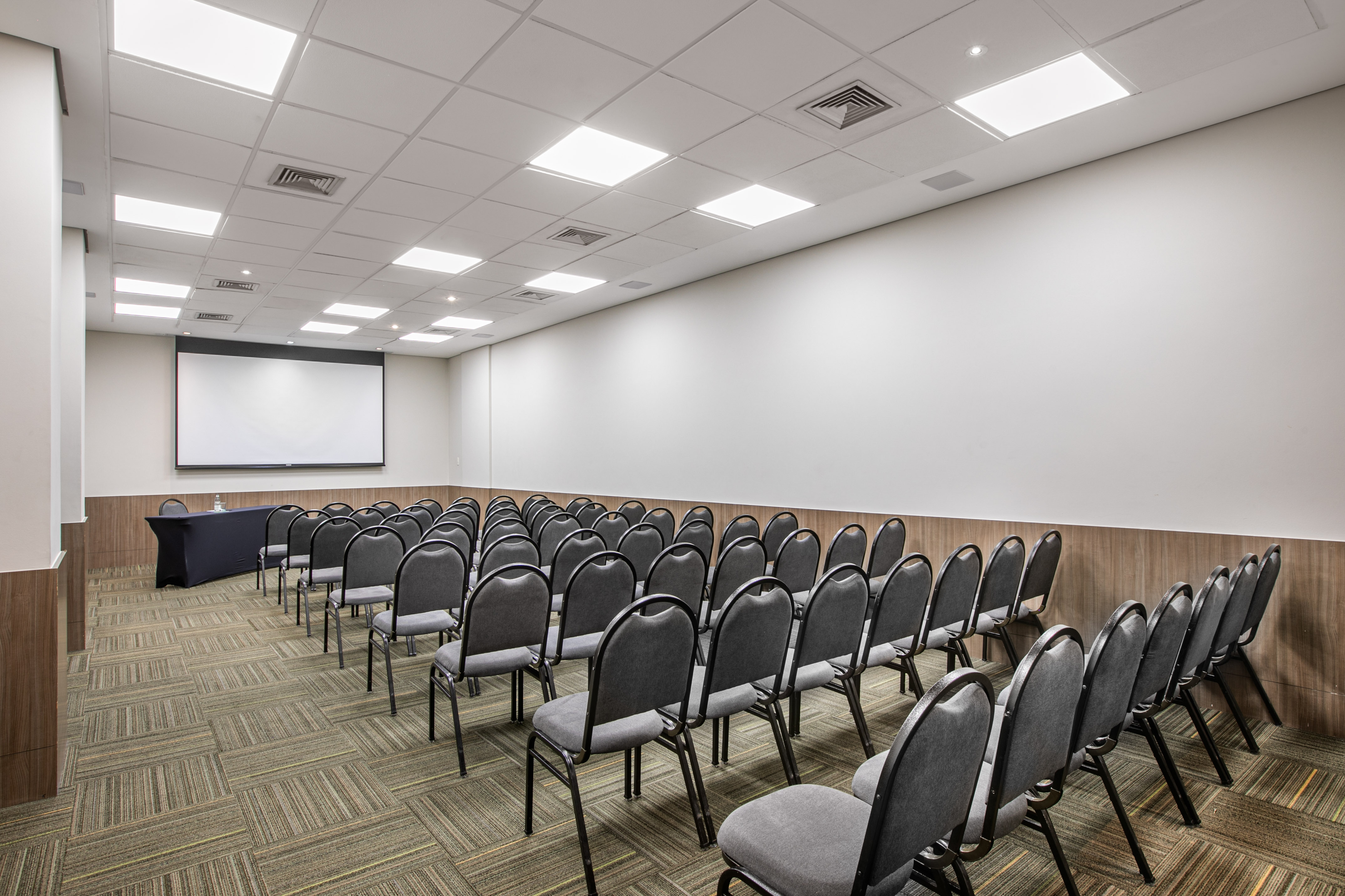 a room with rows of chairs