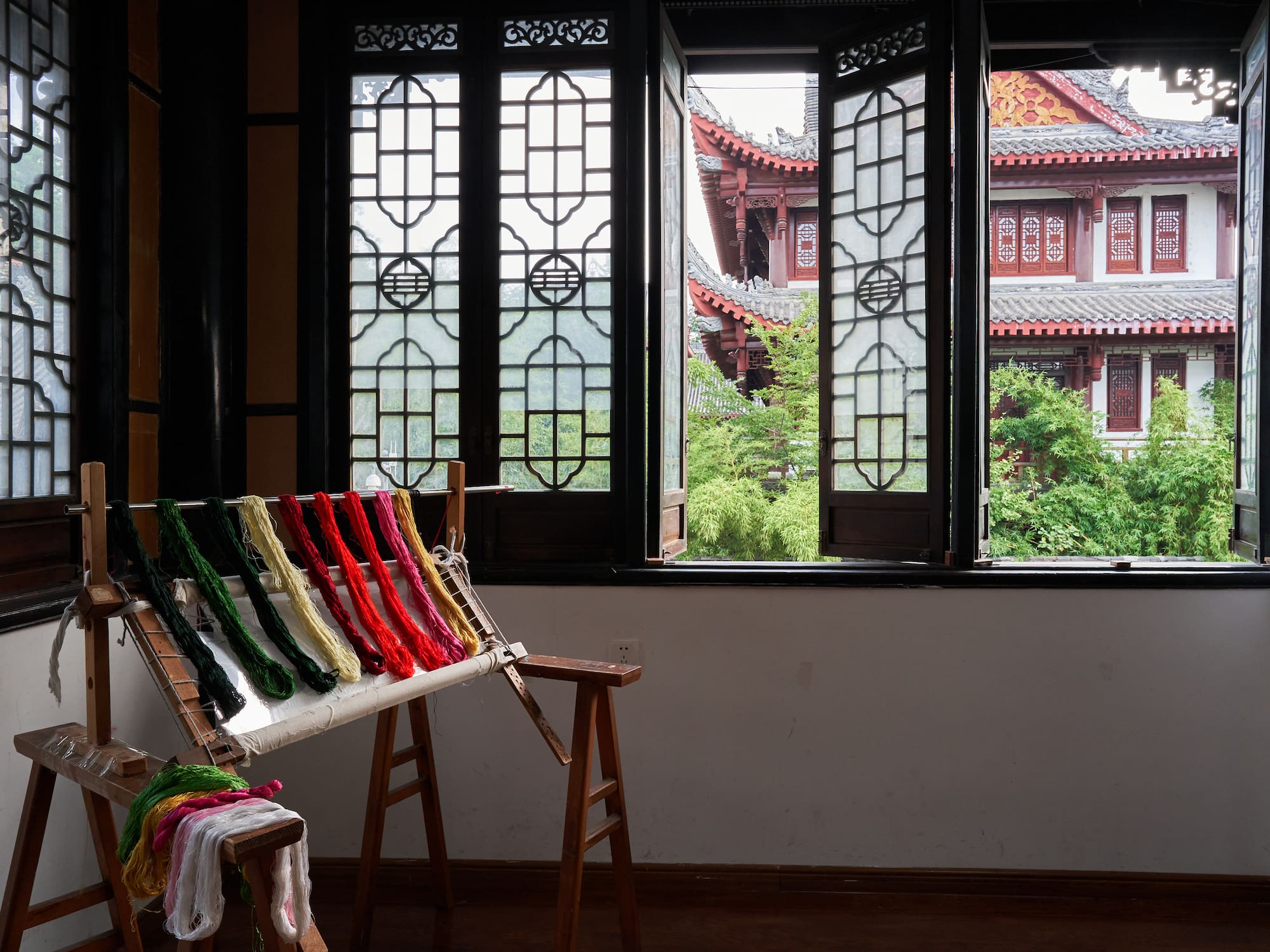 a loom with colorful yarn on it