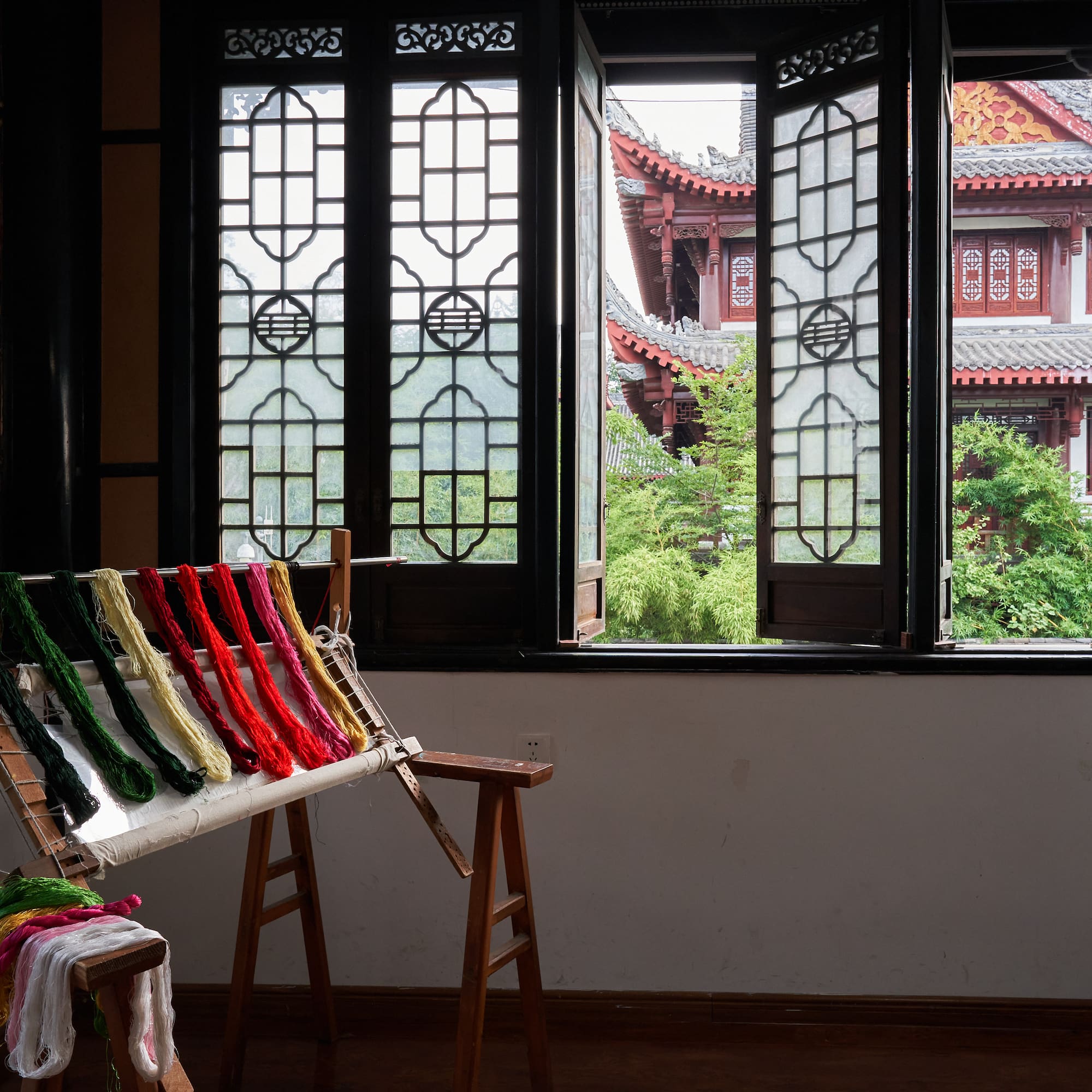 a loom with colorful yarn on it