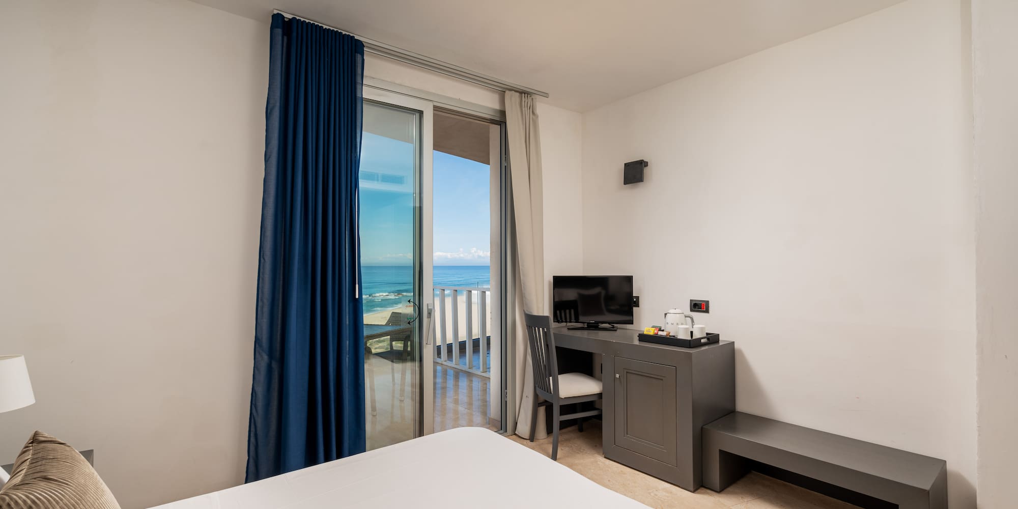 a room with a desk and a computer