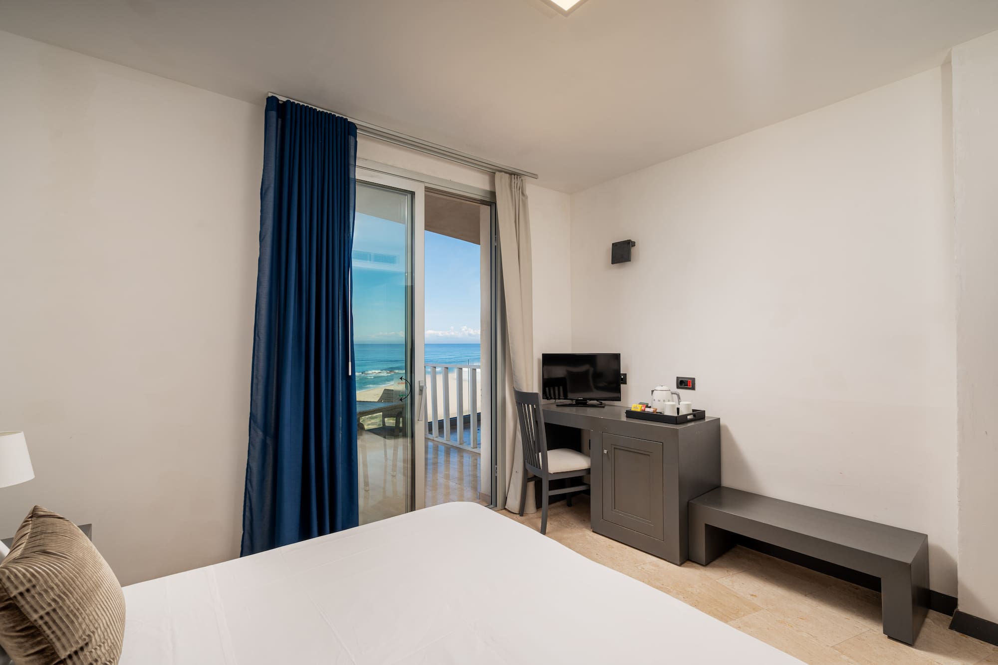 a room with a desk and a computer