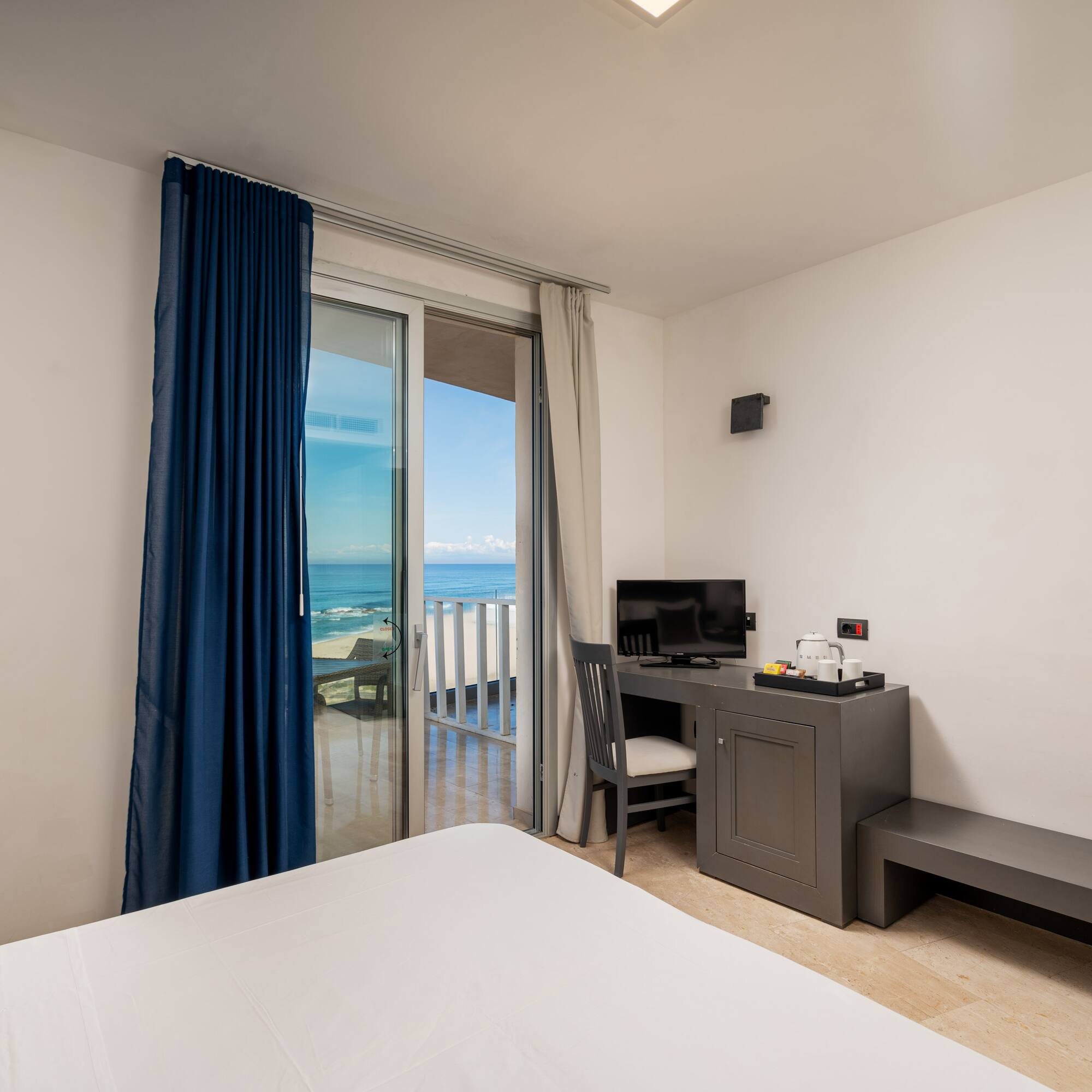 a room with a desk and a computer