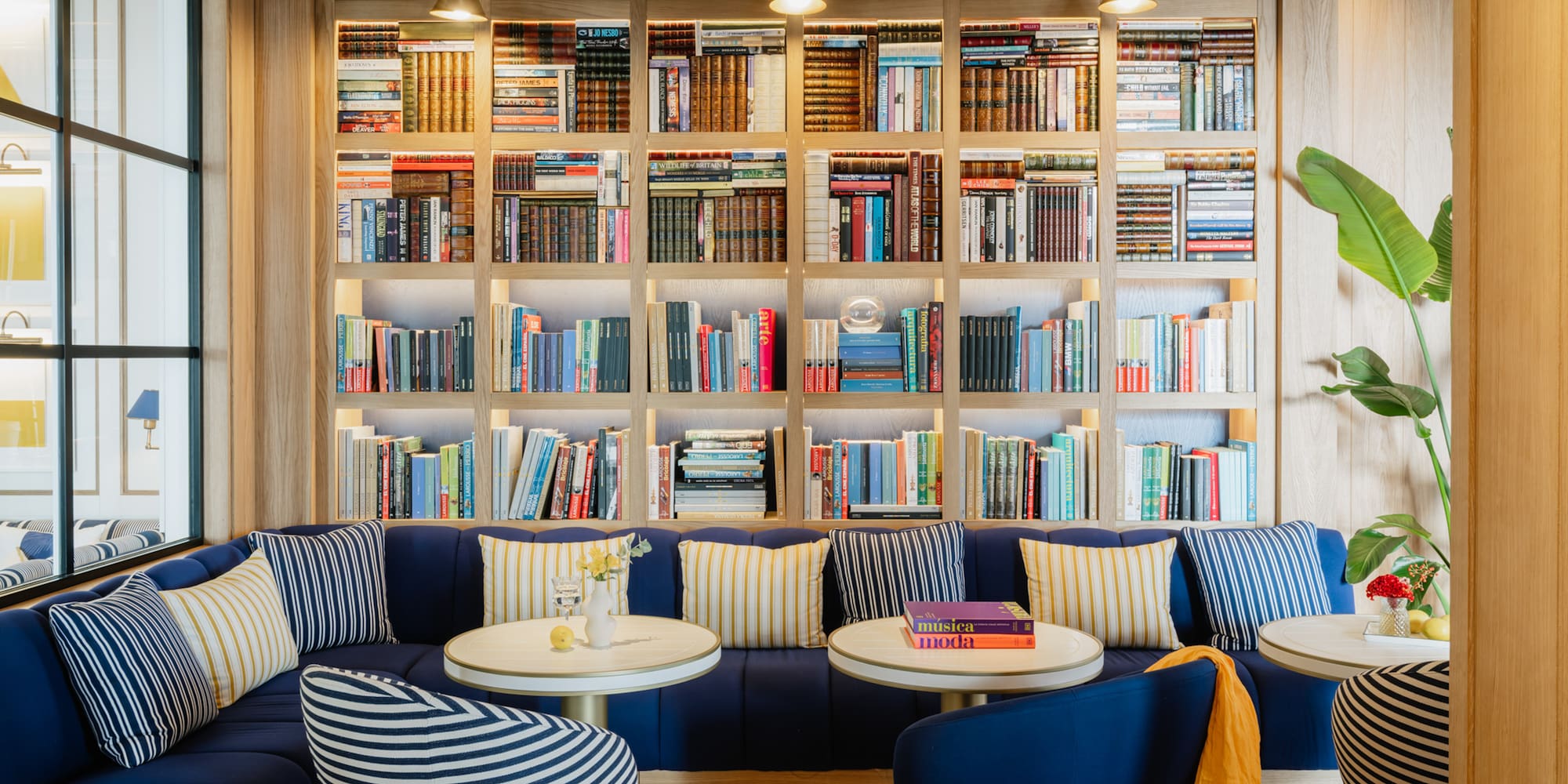 a room with a couch and bookshelf