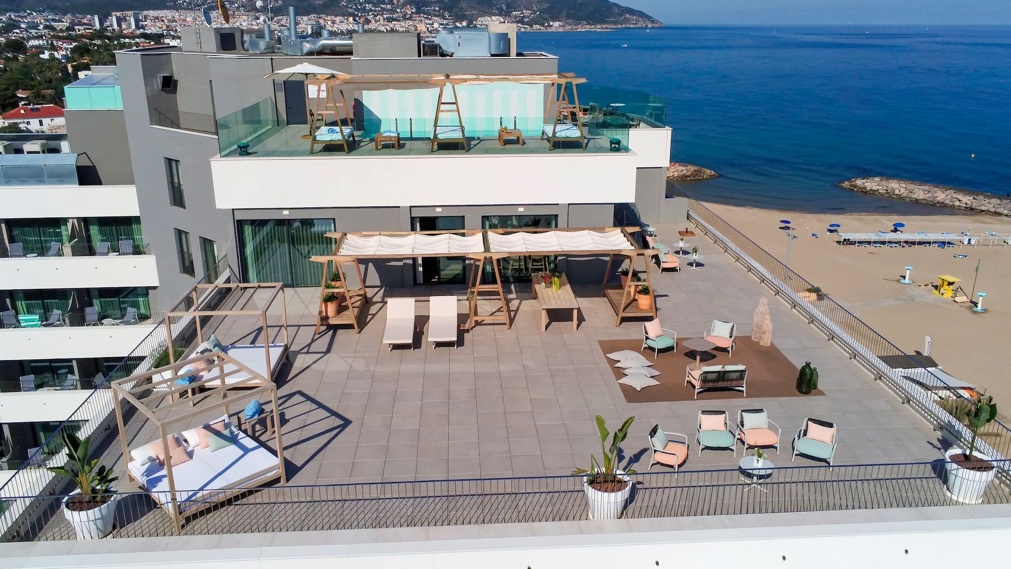 a rooftop of a building with a beach and water in the background