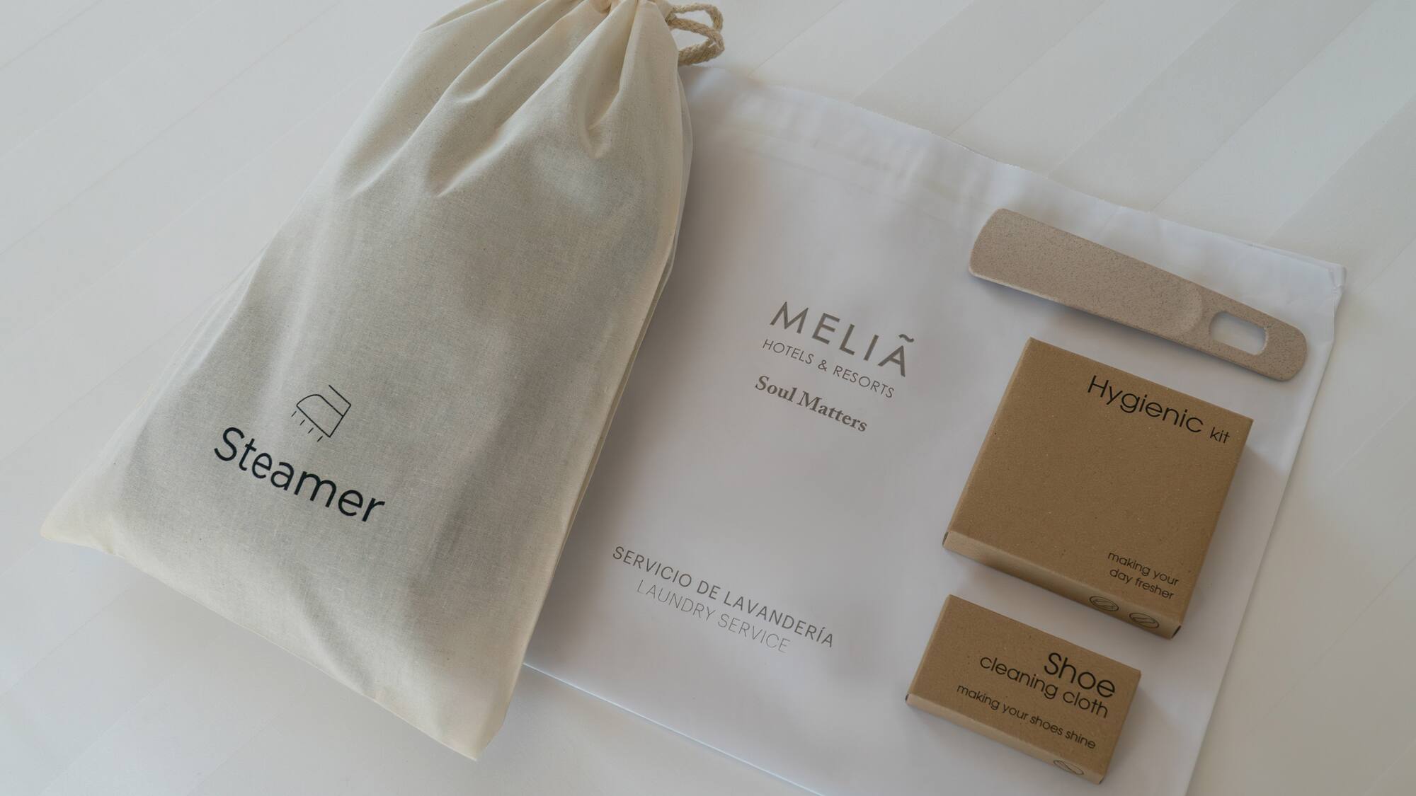 a bag and a bag with a shoe brush