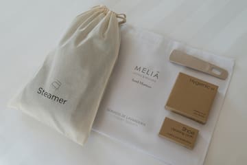 a bag and a bag with a shoe brush