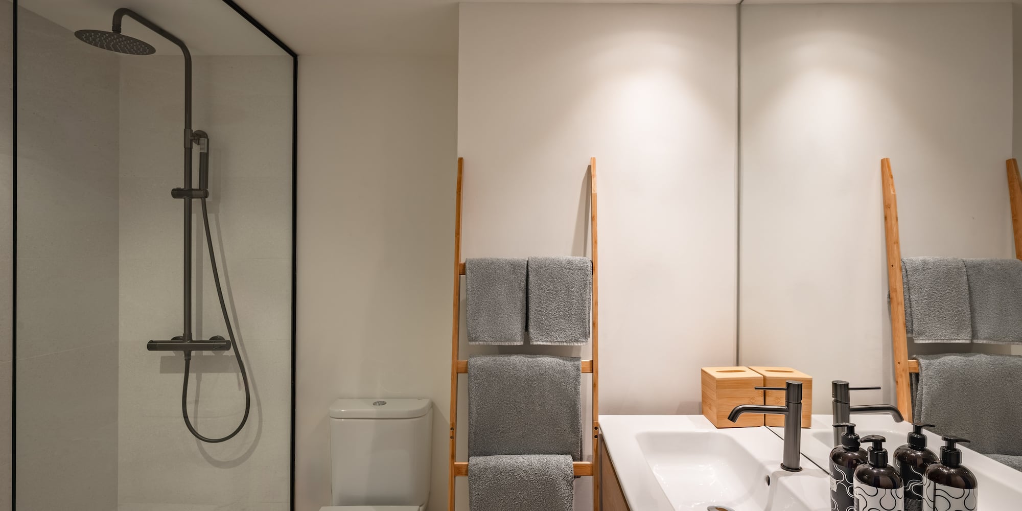 a bathroom with a shower and a towel rack