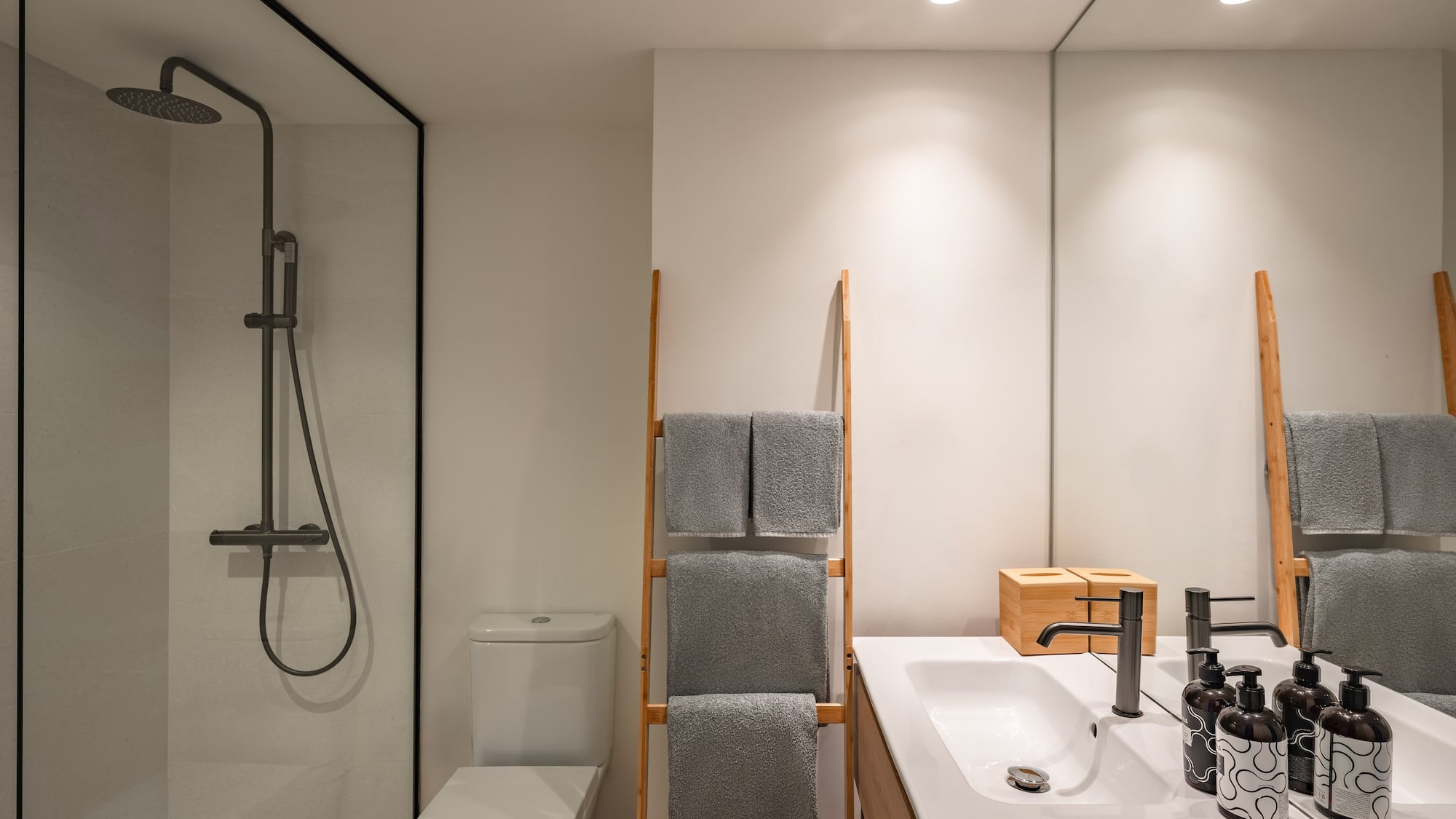 a bathroom with a shower and a towel rack
