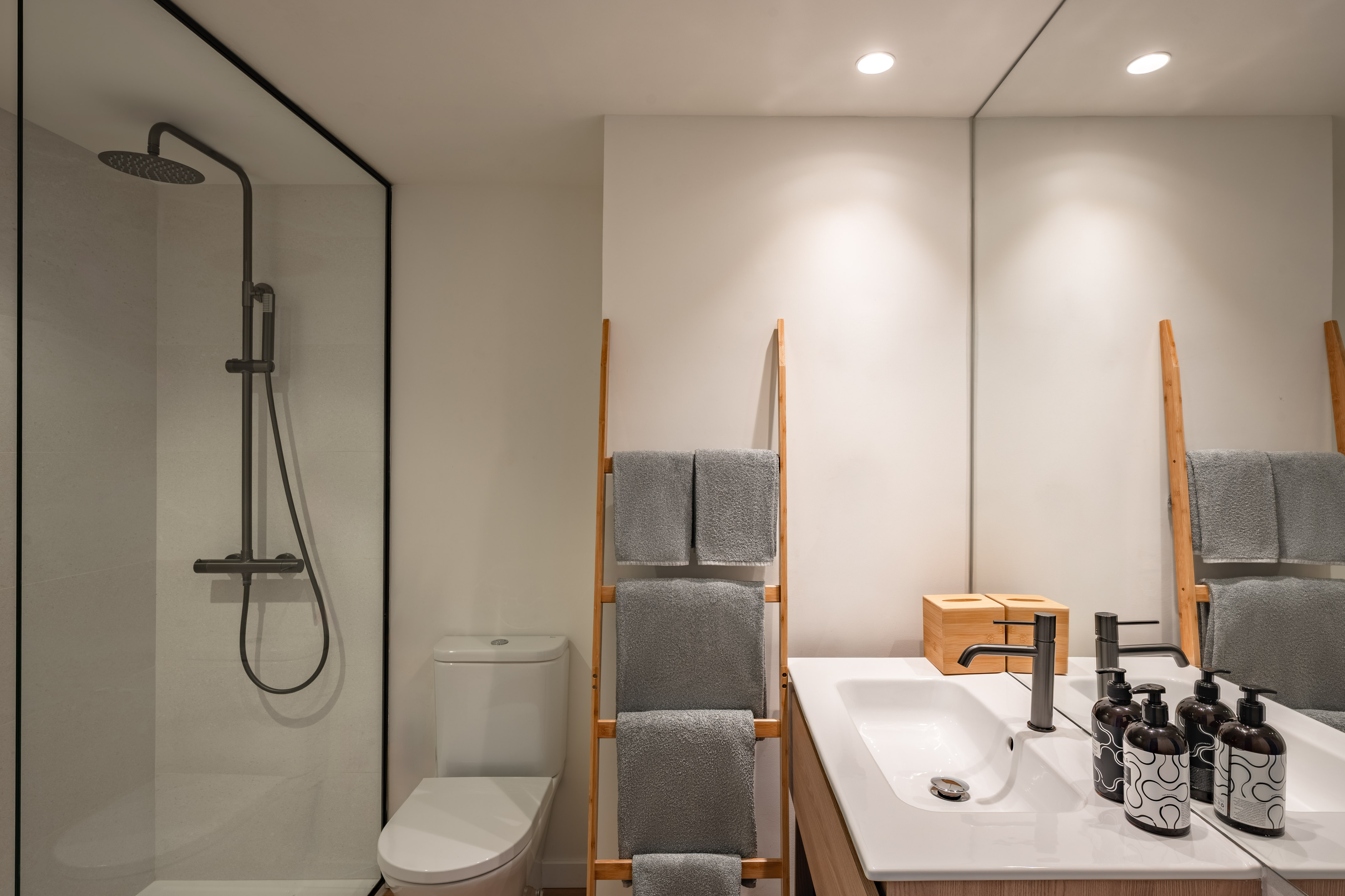 a bathroom with a shower and a towel rack