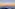 Sombra del Teide al amanecer sobre mar de nubes. Paisaje volcánico.