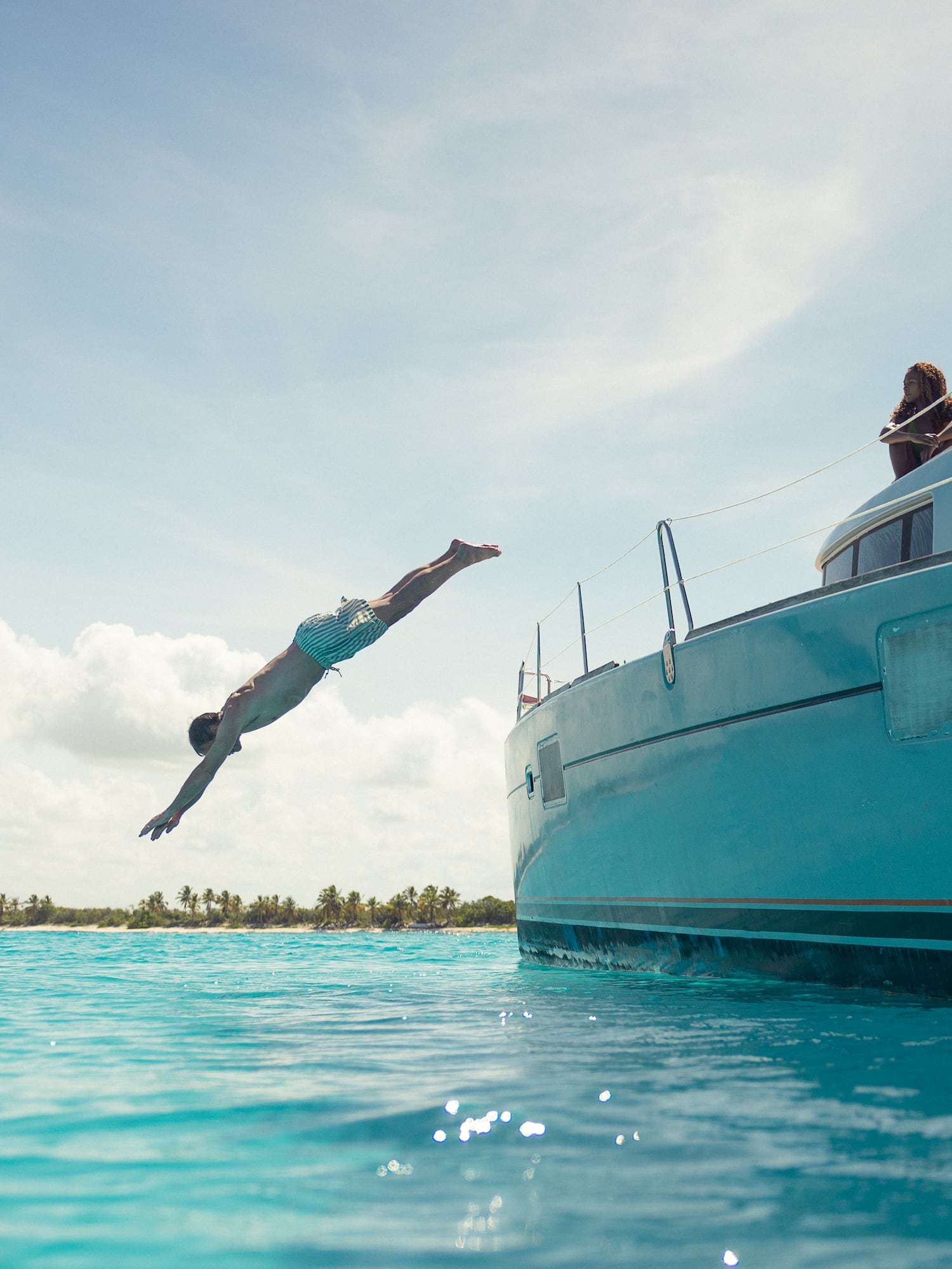 a man jumping into the water