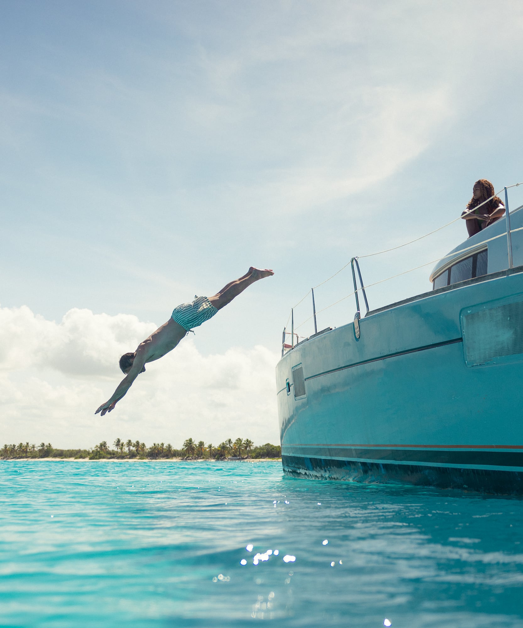 a man jumping into the water