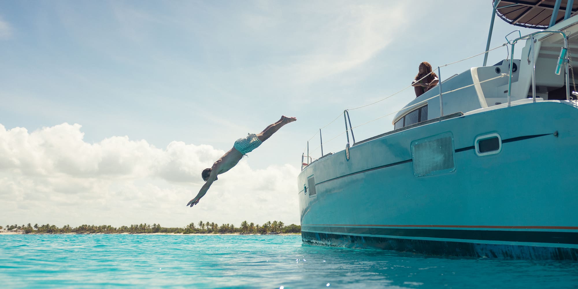 a man jumping into the water