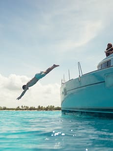 a man jumping into the water