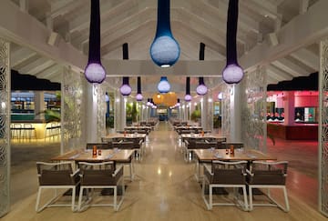 a restaurant with tables and chairs