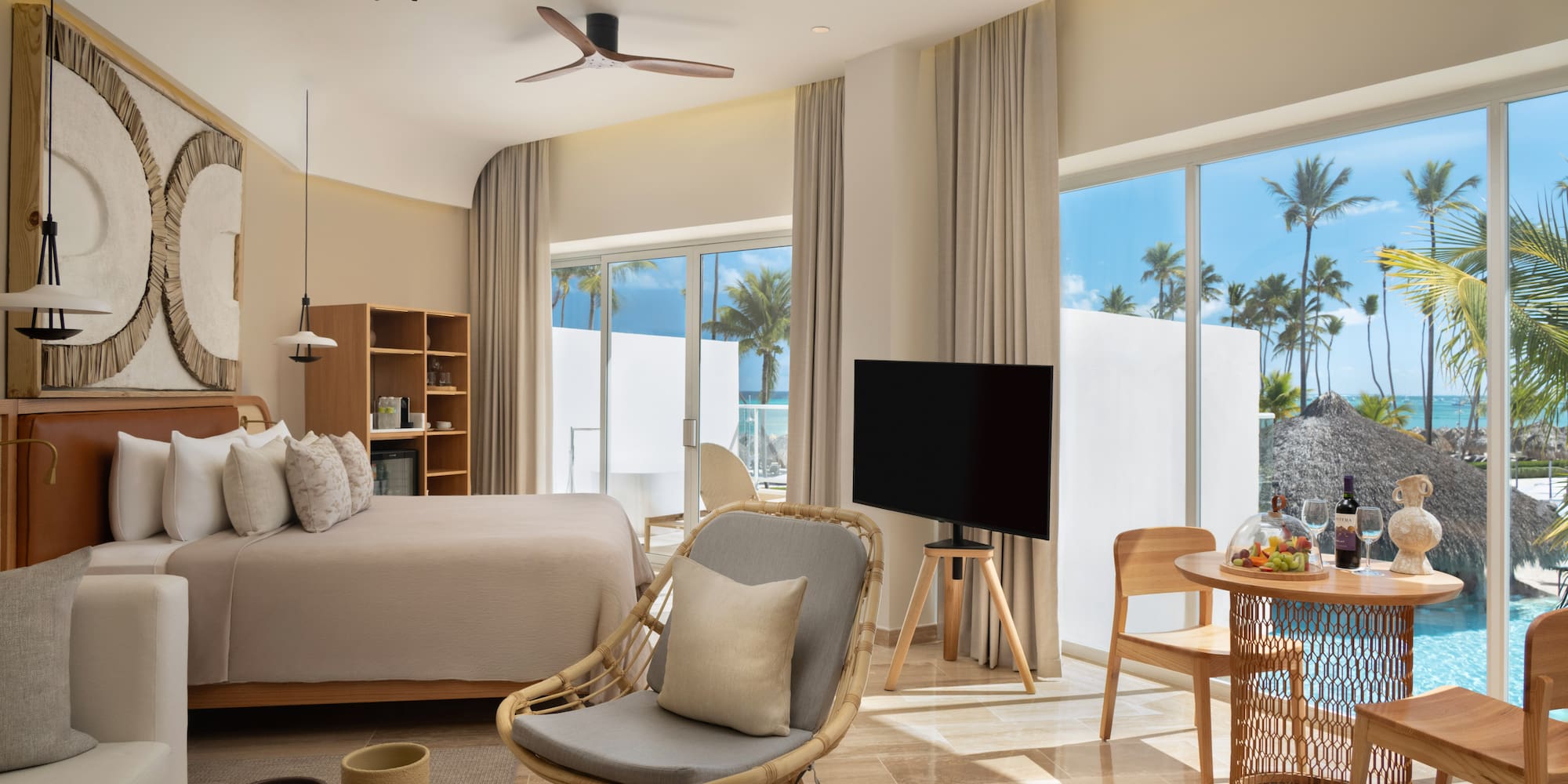 a room with a bed and a television