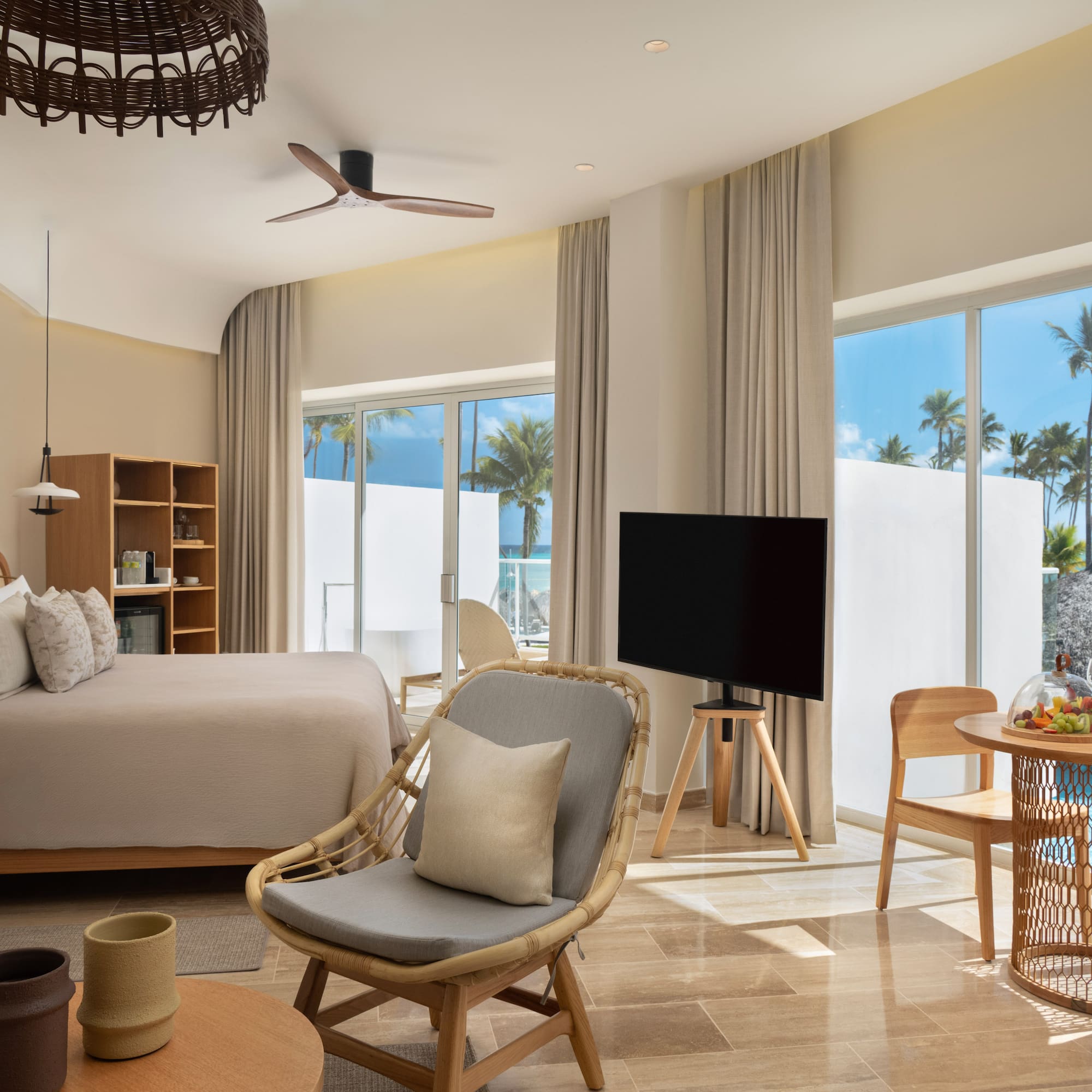 a room with a bed and a television